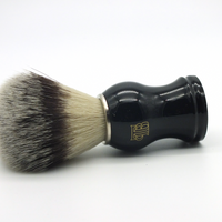 The Personal Barber Synthetic Hair Shaving Brush lying on its side. Silvertip nylon hairs